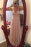 I loved this dress! I wanted to keep it badly, but I was going to be standing up in a wedding and I'm a little particular about how much chest I show when I'm in weddings. I ordered a small and thought it was just a little loose in the midsection, but fit my chest area great. It was definitely long for me but so pretty and flowy! I also didn't have to wear a bra with it which is fantastic! I would have kept this dress if it wasn't for how much cleavage was showing, but alas, I gotta return it. - Rachel P.