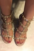 I usually wear a 5, but their smallest size is a 5.5. They fit well on the length but the straps on my right foot are very wide. The heel is thick and comfortable for all day wear but the studs have no material covering their backs between the metal piece and your foot which can be uncomfortable. - Jessenia C.