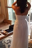This is a more"traditional" style wedding dress. I think I need to have more on top to make it look great on me, but overall I was impressed with the quality and enjoyed the dress. There is one part I didn't like, the tulle is not sewn to the zipper on the back and kind of flaps. Other than that it's beautiful. - Rachele A.