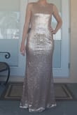I originally bought a size medium as a sample to try on for my bridesmaids dresses to see if I liked it before I purchased all 5. (Usually I'm a small) and the medium fit me perfectly. It is lined with stretchy material so you can definitely get low and sit no problem. Needless to say I went ahead and ordered the rest of my bridesmaid dresses and tried on one of the smalls, just for curiosity, and It was too tight on me. If your thinking of this purchase Definently order a size up. I ordered a size up from what the chart recc for each of my girls and it fit them perfectly. - Jenny F.