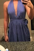 I ordered this dress for a wedding, and it showed way more cleavage than I had originally planned. I eventually was able to pin it and make it work, but the photo where she's covered is very misleading because that's not how the dress truly fits. It's gorgeous, but I had to alter it some to where I'd feel comfortable. - Keighley L.