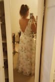 The dress kind of made me look like I had saggy breasts in the front but the back was super cute! - Andrea F.