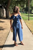 I'm in LOVE with this jumpsuit! It's perfect for summer because of the light and breathable material, also its SO adorable and looks good with any color or accessories! This was definitely a great purchase and I'm so glad I snatched this before it went out of stock again. Whenever I wear this, everyone asks me where I got it, and how cute it is. It's fitted perfectly and has the cutest little belt tie that comes with it! :) I wore this for like a week straight I was so in love with it! - Chloe G.