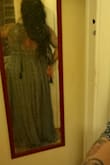 I'm a petite dame who LOVES maxi dresses. And yes, majority of the time I do have to get them fixed up. So with that being said--yes this dress is very long, and I have been holding it up when I walk (kinda makes me feel like a bit of classic grace with it). It's incredibly very light, and not wearing a bra or pasties with this really makes this dress incredibly comfortable. Occasionally, I do have to  adjust the boob area to make sure the girls are not peaking through, but nevertheless--LOVE this dress! - Maria L.