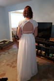 This dress is simple and beautiful. I love the lace detail and the open back. The shape is very flattering, especially if you normally like the a-line look! - Natalie G.