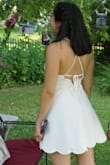 Was in need of a super cute white dress for my engagement party and found this!! This dress was such a success!! Compliments the whole day! The fit is perfect, the length is just right, the low back is flirty but not vulgar, and the material was light for such a sunny hot day. So happy with this purchase. I must say that the only complaint I have is how wrinkly the dress came, so make sure you have time to iron! - Ashley C.