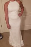 This dress is perfect for my backyard wedding! It's so flattering and almost gives me an hourglass silhouette even though I'm not curvy at all (very "athletic"/rectangular). The large is pretty snug on me but it's stretchy enough that it's still super comfortable. The top/bust part is relatively roomy, I think it could accommodate a much larger bust size (I have the straps tightened all the way). It's super long as seen in the pictures but this allows me to alter it with a train so it's perfect.  The lace is maybe not the highest quality and needs to be handled with lots of care (snags very easily), but for the price point the quality exceeded my expectations. - Breeann M.
