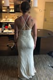 This was a pretty dress, I was looking for a budget friendly dress for a courthouse wedding. The cream color did not do it for me. The neck line was unique and the material was comfortable but I ended up returning this dress. I am tall and there was plenty of length which was a nice surprise! - Samantha G.