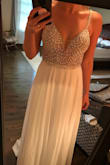 This dress is gorgeous in person. I have already bought a $2000 wedding dress but would wear this in a heartbeat if my mom wouldn't have a conniption! I've decided to wear this for my reception dress-so pretty and comfortable! - Jodi B.