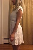 I ordered this dress an engagement party. It's a bear to button and bulges a tiny bit in the chest but I'm very busty. It will be easy to pin. It's super comfortable and got a "wow!" from the fiance! I haven't ironed/steamed it yet but the material is really nice and seems unlikely to shrink much. - Bailey D.