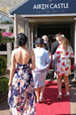 This dress is very beautiful, and was perfect to wear as a wedding guest. I ordered a S but was sent an XS, and it barely zipped up. There is no give to the fabric, so I recommend sizing up then getting it tailored to your specific measurements. - Beth W.