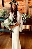 I bought it small and it was a little bit long for me, I had to take it in and had it adjusted but worked out perfect. The dress is beautiful and the fabric is really good quality plus the veil that looks amazing! I wore this for my beach wedding and it couldn't be perfect! - Daniela