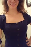This dress is so cute! The length is perfect for my height 5'3 and is conservative enough to wear to the office or a business party. The material is thick and a beautiful Navy blue. The top is sewn shut, so you don't need to worry about the buttons popping open. I am able to wear the dress with a thin bra. The sleeves have no problem staying up as they are lined with sticky stuff...not sure what they call that in the fashion world =). The first time I put the dress on I did need someone else to zip it up for me. Once it stretched a little after the first 2 wears, I was able to zip it up myself pretty easily. It's hand wash only also which I recommend doing since this is a very nice dress! - Marissa V.