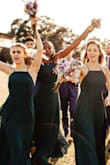 This dress is beautiful. It is darker than the photo, almost more of a dark dark green than a forest green. It isn't quite as low cut on the side so no need to worry about side boob, also the straps are adjustable which is great. A universally flattering cut, great for a bridal party. - Jordan P.