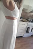 The dress fits nicely around the waist, but is loose around the breasts (the cleavage is way too big). I will have to fix it a bit. The length is actually great, I thought it would be too long, especially considering my height (1.64), but I'm quite happy. I will have it as a wedding dress on a beach. - Ana N.