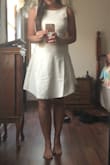 Bought this dress for my rehearsal dinner, love the back and the conservative neckline, the overall fit of the dress is wonderful but the straps are a bit loose so just be aware of this! - MEGAN F.