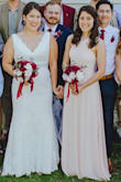 I didn't like this when I first tried it on because the straps in front felt like they belonged on the back. They looked a little odd, but the dress grew on me and I decided to keep it for a bridesmaid dress. The blush color was very nice, but it's pretty long. I didn't alter the length and wore 4" wedges with it, and it still felt just slightly long (I'm barely 5'6"). Also, I was concerned that I wouldn't be able to wear a bra of some sort with it, but I was able to get the stick on ones to fit perfectly. - Heidi P.