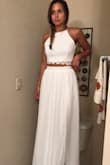 This dress was perfect - exactly what I was looking for: two piece, high slit, high neck. 
I definitely needed an xs but the small would work with some alterations. 
You could wear a strapless bra with it & tie the back straps all the way up & not see the bra strap at all. Not see through either. 
I decided to go with a different dress for my intimate wedding but really do love this. I may order in black to wear for my bridal party! - Mariah M.