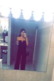 I got this jumpsuit in small and medium because I wasn't too sure which would fit better. The small fit well but was a little too tight, and the medium was just right. It is a perfect length for tall people and covered just enough of my feet with heels on. It was super comfy and the material is really stretchy too. The top part held up really well and there was no need for additional support for upper chest coverage. Super chic! - Tina L.