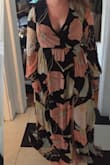 I bought this to wear to a beach wedding! I really like the print, but the large was way too big on me (apart from just the length). I exchanged for a medium and it looked much better. Will need to get it hemmed, and may put in a stitch at the top so that it doesn't open too much.The first photo is the large, the second is the medium! - Molly N.