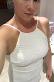 I purchased this dress for an intimate, at home, ceremony. I couldn't go wrong with a price tag of $55 (now even cheaper)! Even though it was a final sale with no return...$55 for a wedding dress was completely worth the risk. I'll have tummy work to do to loose the pooch but the dress fits very well and is comfortable as well as soft. The dress looks exactly as advertised. I went to a wedding boutique recently and tried on dresses galore and they were so uncomfortable and itchy! Satisfied with my purchase and with the right accessories this dress will be perfect! I apologize for the lighting in my pic. The photo does not do it justice. - Bridget C.