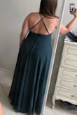 I was very torn between buying the Medium and the Large but ended up going with the Medium as my bust size isn't that big. The waist is stretchy at the back so if you are debating like I was I would go with the smaller size. The size chart says 28 - 29 inches for dresses but I'm around 34 inches and it fit fine. It was a bit snug on me (but not uncomfortable) once the small clip at the top of the zipper was done up but again, the large would have been too big on me especially in the bust. I did have to get it hemmed because of my height but I was expecting that based on other reviews. I didn't have to wear a bra with this, however you could do petals or a sticky bra. The sides were a TAD loose but not enough to get it fixed because I was worried about it or anything. The adjustable straps really helped with that. Loved the colour, exactly what I was expecting. The fabric was heavier and I was dreading wearing it a bit because September weather can be crazy hot or cold but it was cool out so I was good to go! I did order this from Canada and it took maybe 2 weeks with about $35 in duty attached when I got it. Overall, amazing dress. I have absolutely no regrets about this purchase and would highly recommend. - Audriana R.
