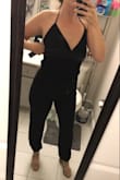 I originally ordered the large because I have a hard time with jumpsuits as I have a small top and large hips. However, I ordered the medium as well because the fabric has some give and the medium fit perfectly! I love that I can dress this jumpsuit up or down. I feel sexy and sleek, as I find this to be extremely flattering. I found that I have to tie the strings a little tight to compensate for the front and it's a little snug in the armpit, but it still is comfy! - Lauren C.