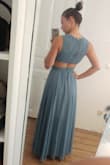 I ordered the dress from Germany and it took only two weeks to arrive. The dress fits perfect. I can even wear it without a bra because the material is thick enough and the overall quality is amazing. I will order again. I love the website! - Sherin S.