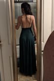 If you have an hour glass figure, this dress is very flattering. The open back is beautiful. Only get this dress if you feel comfortable wearing low cut. I might have to take in a few centimeters from the side cleavage and hip areas. - Maria A.