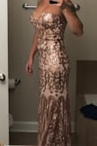 I ordered up a size due to bust size (like suggested on website) and it fits perfectly! If I wanted to get it altered I could but it's not necessary! It is a DREAM. I tried it on and my husbands reaction was perfect! He loved it as much as I do! Will be wearing to his Marine Corps Birthday Ball in November! - Katherine W.