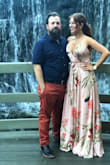 I bought this dress for a wedding in Malibu and the reviews were back and forth on the size. I decided to just go with my gut and get my usual size - medium. It fit like a glove. A bit long but I liked that for drama. The colors are gorgeous. The fabric is stunning. Felt very expensive on. I got a zillion compliments. If you're reading this and you're on the fence, I can promise you... you will look like a million bucks in this dress. It's feminine and simple yet eye catching. I did use fashion tape to secure the fabric on my chest area and wore pasties. Just a little tip. - Micaela B.