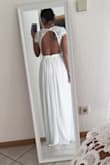 This dress fit like a glove and looked so effortlessly perfect. I ordered 3 dresses and had a very hard time choosing. I didn't choose this one only because I was in a colder climate and wanted sleeves but if I was somewhere warmer this would've been my wedding dress hands down. - Belinda M.