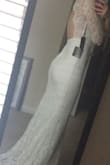 This dress is beautiful. I love the lace and the feel. It's very comfortable and is perfect for my height. Most of the dresses I've tried from Lulus need to be hemmed seriously; my toes just barely peak out, and since I want to wear flats this is perfect. I think it fits perfectly but I know I am very petite through the rib cage and torso. The back bottom has a small bit more fabric that makes it drape lovely and hang elegantly. I love the back cutout as well. I've even purchased a rhinestone belt with a bow that I can opt to wear.
This dress beats all The others I've tried on. I truly love it. - Chelsea C.