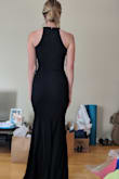 The XS fits perfectly and is true to size. The material is high-quality, stretchy but thick and comfortable. The length is perfect, too. I'll probably need to wear a small heel (2' or so) but could get away with flats if needed. This was my favorite dress of the five I ordered. If you have a bigger chest, I would maybe consider a bigger size because of the cut of the arms. - Olivia F.