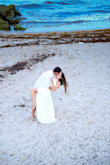 The skirt is very very long, even with heals it will drag. I decided to not get it hemmed and it was very difficult to walk in. I had to hold it while walking. Besides that, it compliments the body very well and looks amazing in photos. I used it for our engagement photoshoot. - Glenya A.