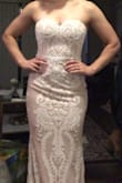 This dress fit even better than I thought it would. I was a little worried because the product info says fits A-C cup and I'm a DD, but it fit perfectly even with a strapless bra. The boning holds the dress up pretty well and the quality is definitely above the price point. It is realllyyyy long but that's to be expected on me. My only complaint is that the lace is so thick it prevents the zipper from moving freely so it was a struggle to zip up where the bodice meets the skirt part. - Krystle H.
