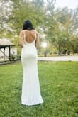 The material is perfect. The lace detail and fitted material really hugs the curves. I will have to get it hemmed, but I am 5'2 and already expected to. This is a stunning dress. - Sylvia B.