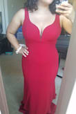 In all honesty it is a beautiful gown. I was looking for a guest dress and thought this would be perfect but in the end I decided to return it because it was more fitted than expected and I decided to go with another dress that wouldn't show my belly. - Xochilt P.