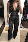 I love this jumpsuit! I was worried about the length because I am on the shorter side but with a cute pair of black heels it's the perfect length! It's very fitted for me from the waist up and I don't think I would need to wear a bra with this. From the waist down it's a teeny bit looser than I would have liked but it still looks great in my opinion! - Samantha N.