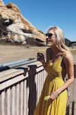 I love everything about this dress. The color is bright but still flattering, and the back of the dress is laced so I am able to make the waist as tight or loose as I want. On top of it, the midi length is very flattering for me, which can be tough to find being so tall. I wish it came in 10 more colors! - Callie G.