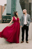 I bought this dress to wear for our more formal engagement photos and it was perfect! I fit very well and my chest felt very secure. The color it absolutely gorgeous in person. A little more purple/fushia than I expected because the photo online looks more Burgundy in my option, but I was so happy with what I received. We just got out photos back this week and everyone has complimented the dress. I would definitely recommend that you buy this dress!! - Jillian R.