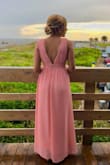 I got so many compliments on this dress when I wore it last weekend for an outdoor beach wedding. It's flattering on all colors, shapes, and sizes. It does however run very long and a little loose in the chest area. I ordered a size small and had to get it hemmed to be shortened a few inches and taken in under the armpits as well as the other girls in the bridal party which cost an extra ~$60 since there are 3 layers. Even with heels on and hemmed, we were tripping over it a bit. Still, worth it and happy with the purchase! Pretty dress! - Lauren N.