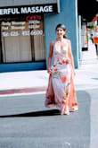This dress was beautiful. I wore this to a summer wedding and received a lot of compliments. It flows very gracefully when you are walking. I am short and petite (5'2"), and ordered an XS, and would caution that this dress has A LOT of fabric & it was incredibly long even with wearing heels. I got it tailored (hemmed) because I loved the feel of it so much. Attaching random pictures my friends took. - Vicky K.