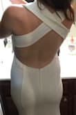 I ordered 5 white dresses in order to choose my favorite, and this one ended up being my second favorite. It really is gorgeous - I think the photo here doesn't do it justice because the model is doing a weird sidestep, where in reality it looks more elegant than that. The reason I didn't choose to keep it, though, is because the criss-cross straps were too wide and there ended up being too much fabric between my neck and shoulders, so I'd only recommend it to someone with broad shoulders. Also, the open back is very sexy, but I thought that the stretch material that runs across the bottom back looked kind of cheap. Other than those issues, it was beautiful and I wish I could have kept it. - Leila M.