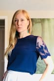 This shirt is beautiful in person. The sleeves really set it off. My roommate accidentally put it in the washer AND dryer and it made it out unscathed.
The fabric is very professional for a work environment (not see-through). Tuck it into high-wasted pants or wear it with something low wasted. It's a great length for both. - Alana C.