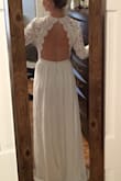 I'm an athletic build and while the dress fit perfectly in the waist, the arms were loose and sloppy. Lace is beautiful and the back is truly gorgeous!! - Mackenzie A.