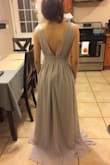 It's a beautiful dress. Wore it for a wedding. Very nice and flowy. I got an XS, but it was still big on me. Very long too! I had to have altered to fit me right. But the dress is very nice! - Paola G.