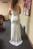 This dress is so gorgeous and quite figure flattering. I'm a pear shape so I had to order a Medium and it fit my waist and hips well, but the top was a tad loose. The lace is very detailed and the train was my favorite part. Initially bought to wear as a wedding dress, still deciding between a few dresses but overall I love it. - Ana D.