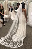 I loved this dress, but I ended up going with another Lulus dress. If you have a tight budget, this dress is for you. I would recommend getting a mermaid slip to give it more shape (see picture). Also, this dress doesn't stretch, so that's something to take into consideration. When I brought it to the bridal store to get my veil, they actually thought the dress was from their store, so that speaks to the quality of the dress. The underlay is nude and the dress is slightly off white. I would've also needed to get it hemmed if I had gone with the dress. - Libriel P.