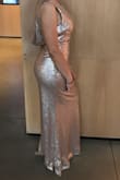 I wore this for my brother's wedding. With the reviews and the sizing chart, I was able to decide on getting a medium and it fit absolutely perfect! The only thing I had to do was get it hemmed as it was made for a model who was 5'7" but otherwise it hugged my curves in all the right places. It was beautiful. I felt like royalty and the quality was great too. I was pleasantly surprised. The pictures don't do it justice. - Sherrie R.
